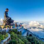 Landscape with 
Giant Buddha statue on the top of mount Fansipan, Sapa region,  Lao Cai, Vietnam