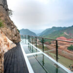 See Bach Long glass bridge in Moc Chau district, Son La province, Vietnam with a total length of 632 m, this is the longest pedestrian glass bridge in the world