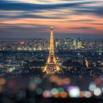 Paris city in the evening with the Eiffel tower and La Defense b